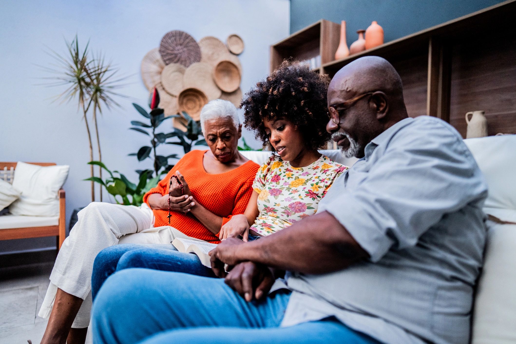 People reading the Bible and praying together